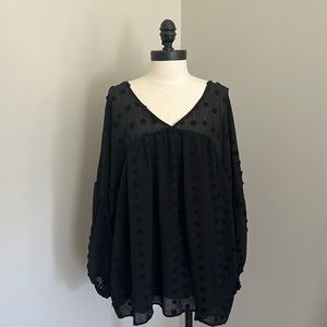 Black chiffon lines top with polka dot design.
